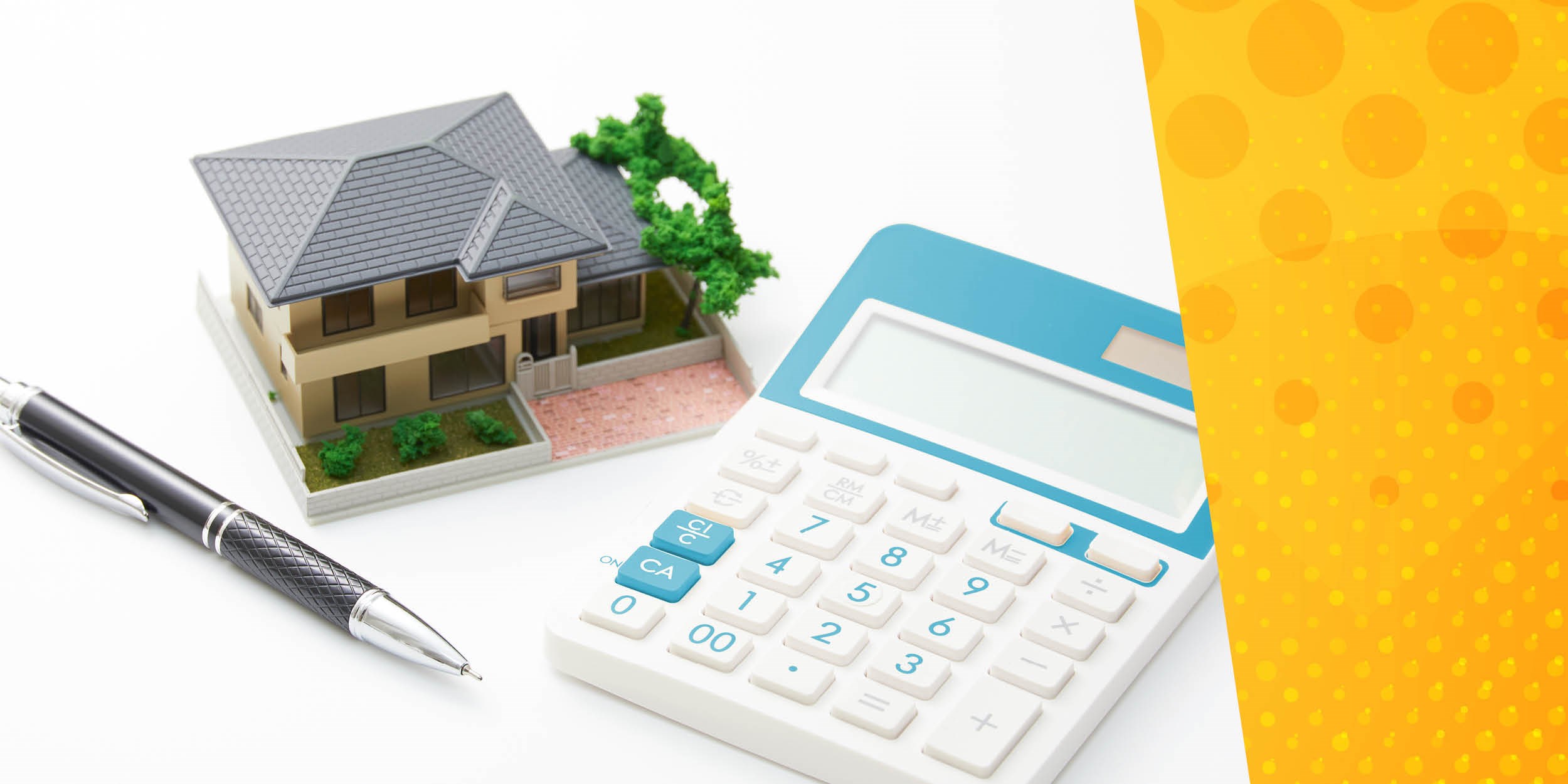 Miniature model house, calculator and pen with yellow spotted background